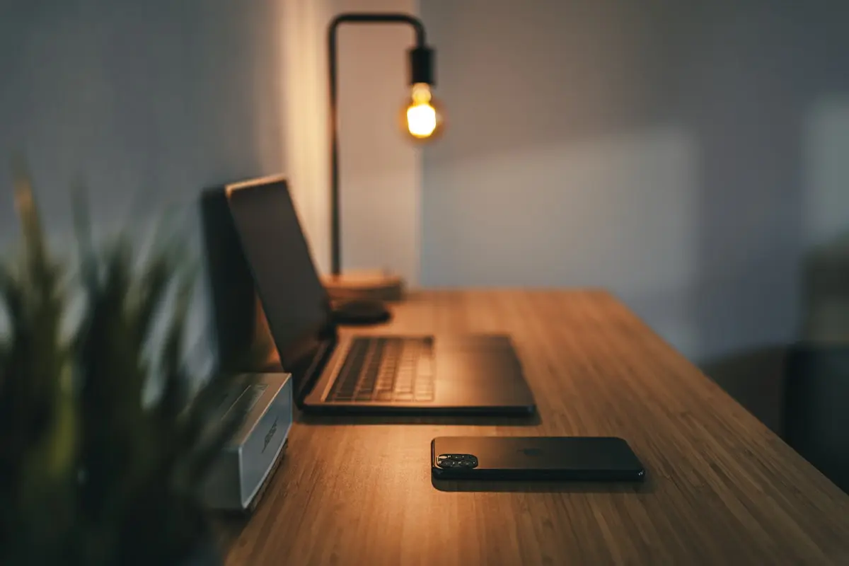 A bright, minimal home office with adjustable desk and natural light